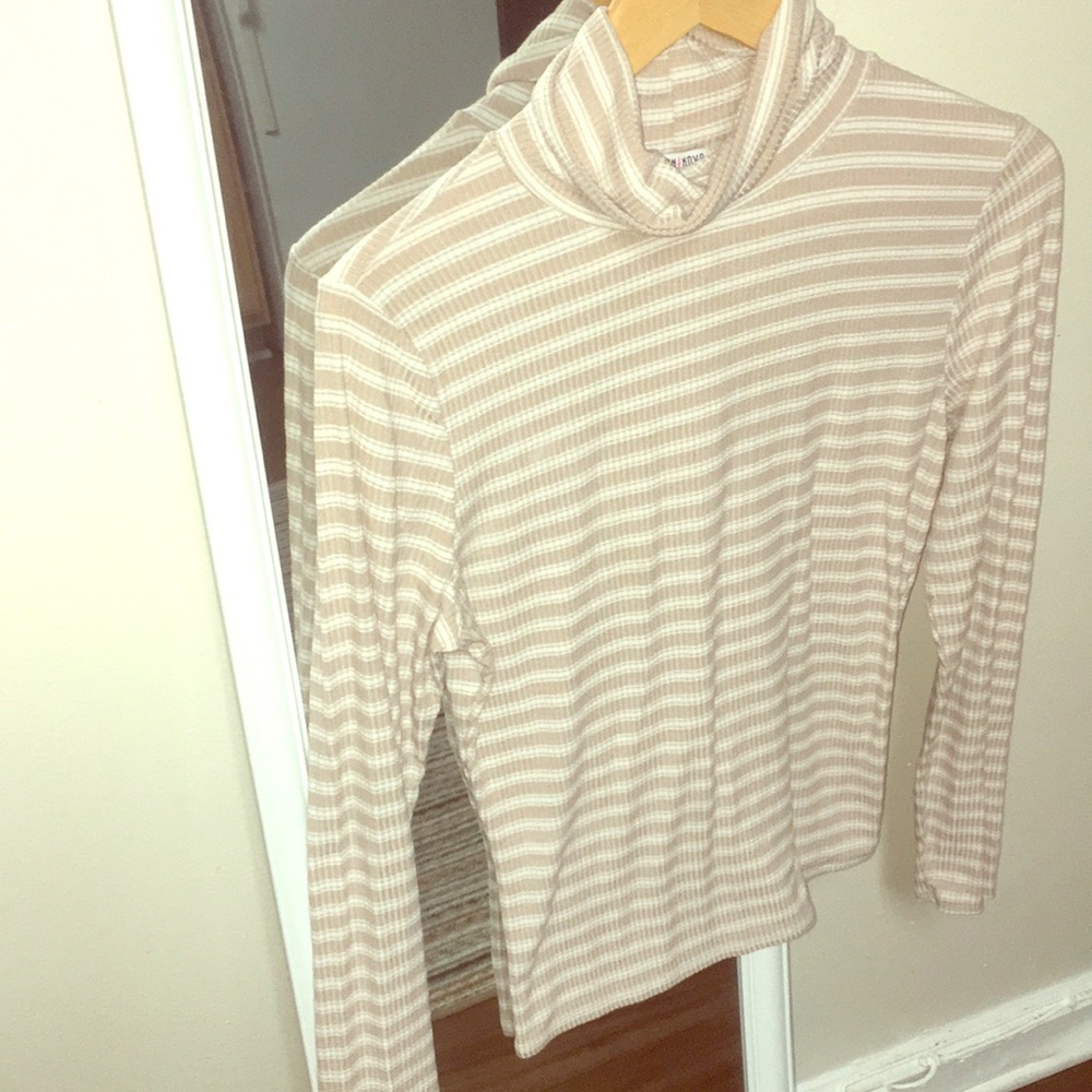 Tan and white turtle neck